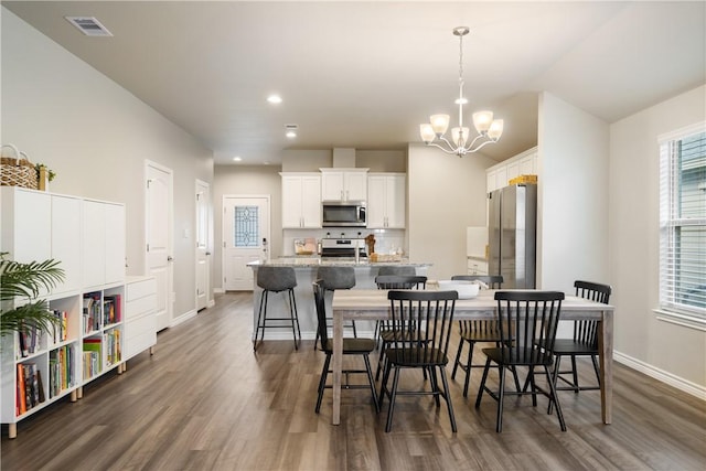 1142 Breebry Dr, Corpus Christi, TX 78415 - dining area featuring a chandelier, dark wood-type flooring, and recessed lighting