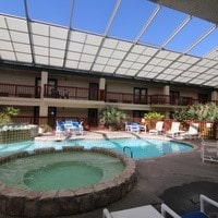 view of swimming pool with an in ground hot tub