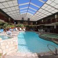 view of swimming pool with an in ground hot tub