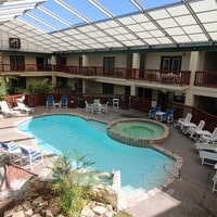 view of pool featuring a patio and a hot tub