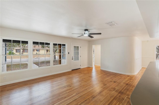 unfurnished room with ceiling fan and light hardwood / wood-style flooring