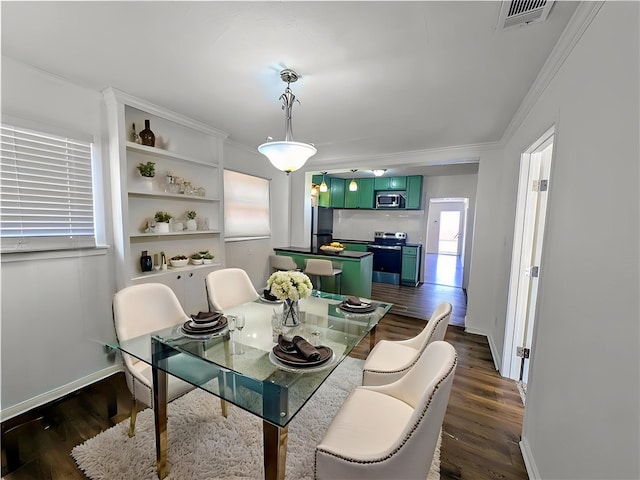 2853 Lawnview St, Corpus Christi, TX 78404 - dining space featuring crown molding and dark wood-style floors