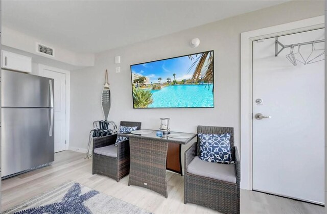 800 Sandcastle Dr Unit 107, Port Aransas, TX 78373 - office with light wood-style flooring, visible vents, and baseboards