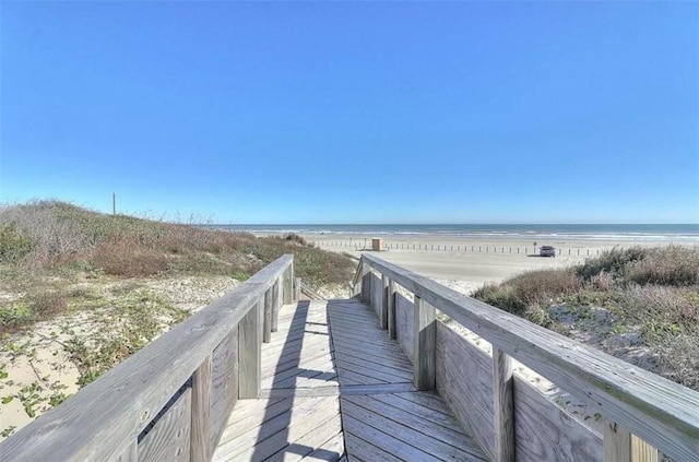 800 Sandcastle Dr Unit 107, Port Aransas, TX 78373 - view of property's community with a water view and a view of the beach