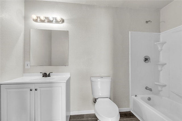 130 N Houston St, Aransas Pass, TX 78336 - full bath featuring toilet, vanity, wood finished floors, and  shower combination