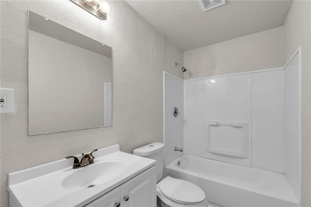 130 N Houston St, Aransas Pass, TX 78336 - full bathroom with a textured ceiling, toilet, visible vents, a textured wall, and vanity