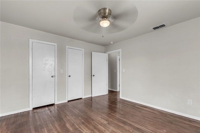 130 N Houston St, Aransas Pass, TX 78336 - unfurnished bedroom featuring baseboards, a ceiling fan, wood finished floors, and visible vents