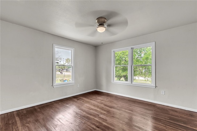 130 N Houston St, Aransas Pass, TX 78336 - empty room featuring baseboards, wood finished floors, and ceiling fan