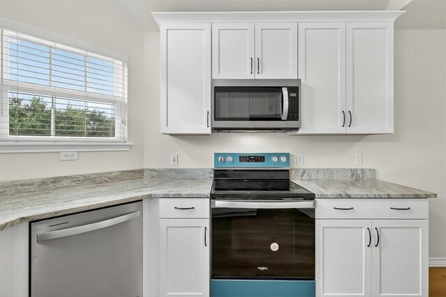 7821 Kingshire Dr, Corpus Christi, TX 78413 - kitchen featuring appliances with stainless steel finishes and white cabinetry