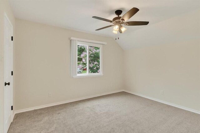 7821 Kingshire Dr, Corpus Christi, TX 78413 - empty room featuring carpet floors, ceiling fan, and vaulted ceiling