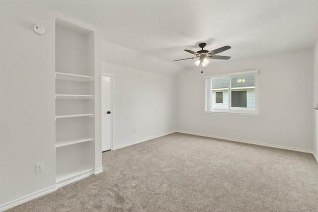 7821 Kingshire Dr, Corpus Christi, TX 78413 - carpeted spare room featuring a ceiling fan, built in features, and a smoke detector