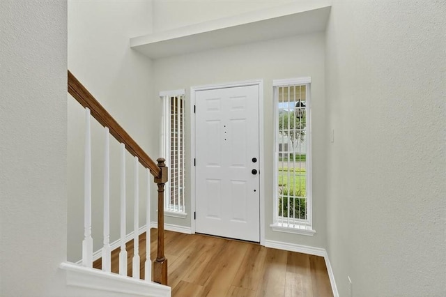 7821 Kingshire Dr, Corpus Christi, TX 78413 - foyer featuring wood finished floors and stairway
