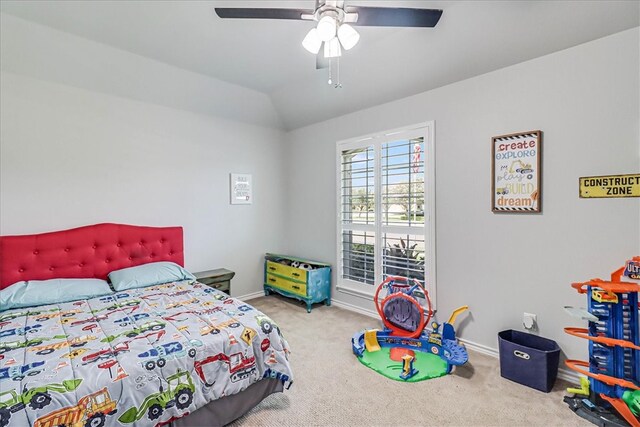 bedroom with carpet, vaulted ceiling, and ceiling fan