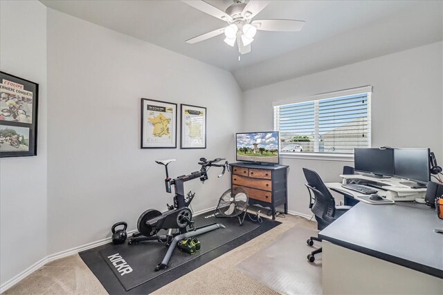 office featuring ceiling fan, carpet flooring, and vaulted ceiling