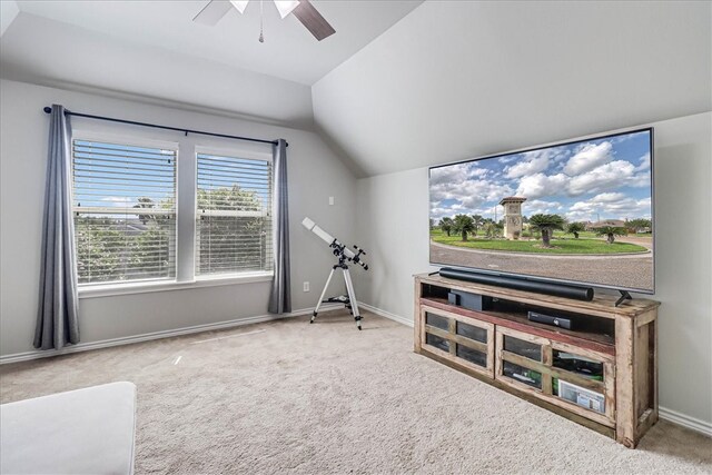 interior space with carpet flooring, lofted ceiling, and ceiling fan