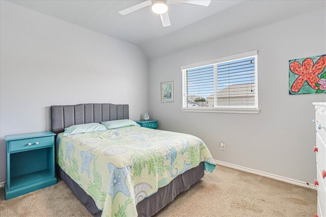 bedroom featuring lofted ceiling, light colored carpet, and ceiling fan