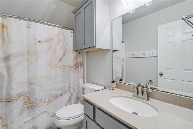 bathroom with vanity and toilet