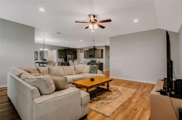 7602 Bayley Ln, Corpus Christi, TX 78414 - living area featuring ceiling fan, a chandelier, light wood-type flooring, baseboards, and recessed lighting