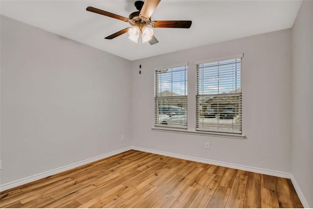 7602 Bayley Ln, Corpus Christi, TX 78414 - empty room featuring ceiling fan, baseboards, and light wood-style flooring