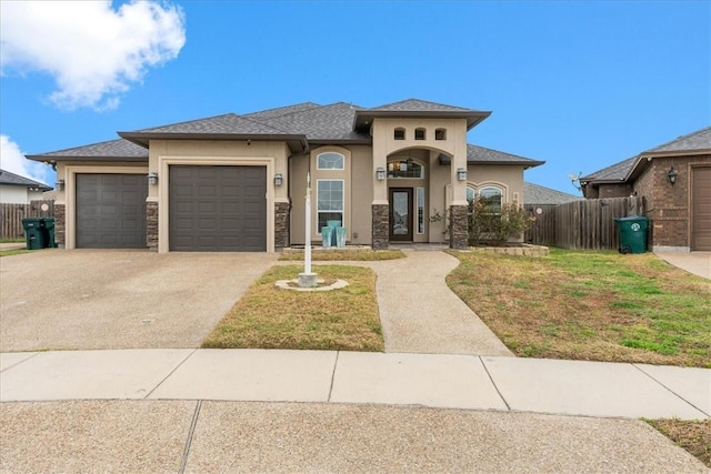 view of front of house featuring a garage and a front yard