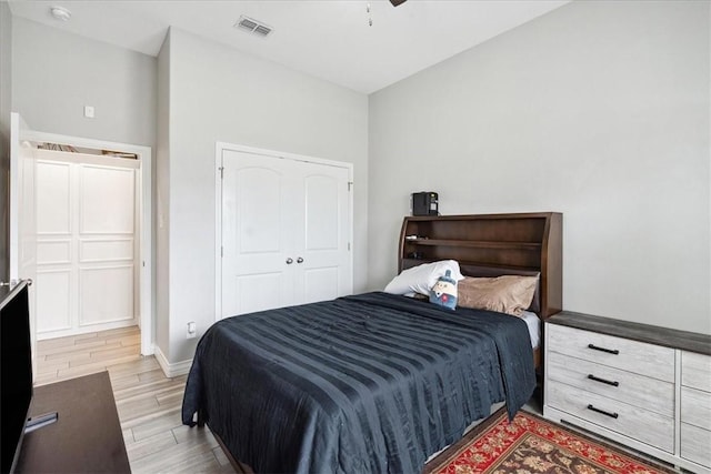 bedroom featuring a closet and light hardwood / wood-style flooring