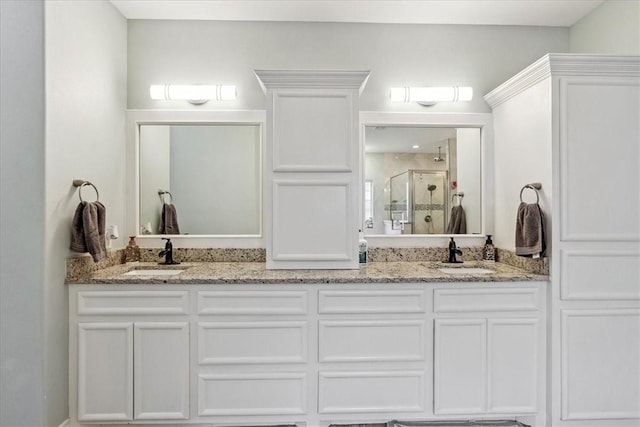 bathroom with vanity and an enclosed shower