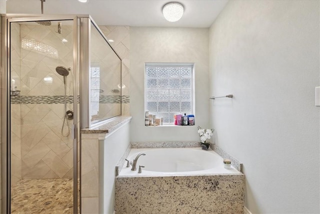 bathroom with shower with separate bathtub