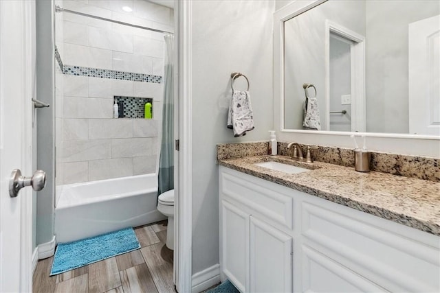 full bathroom featuring toilet, vanity, and shower / bathtub combination with curtain