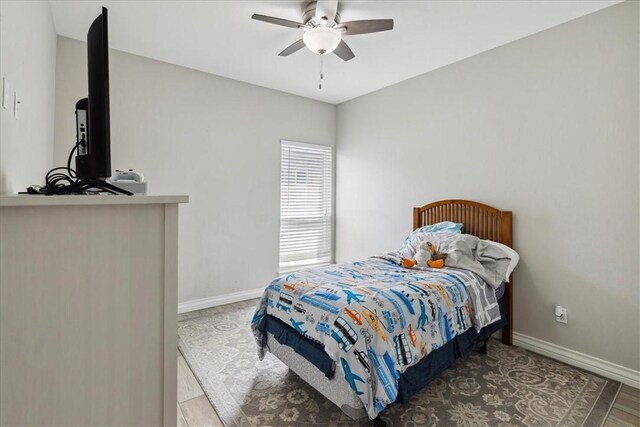 bedroom featuring ceiling fan and hardwood / wood-style floors