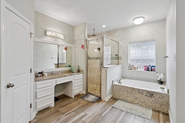 bathroom with vanity and plus walk in shower