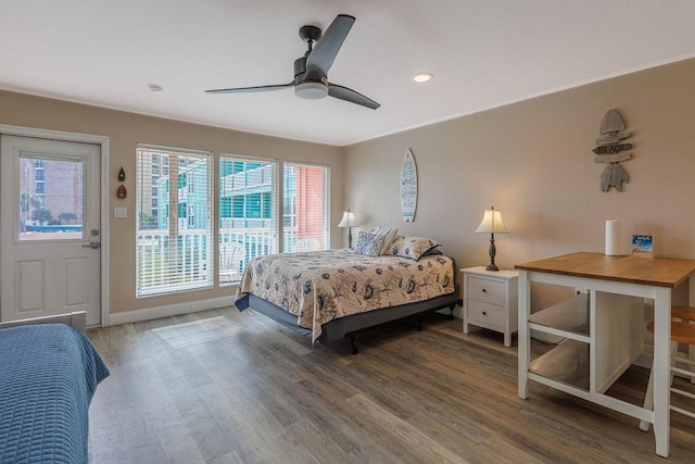 bedroom with ceiling fan, access to exterior, and hardwood / wood-style floors