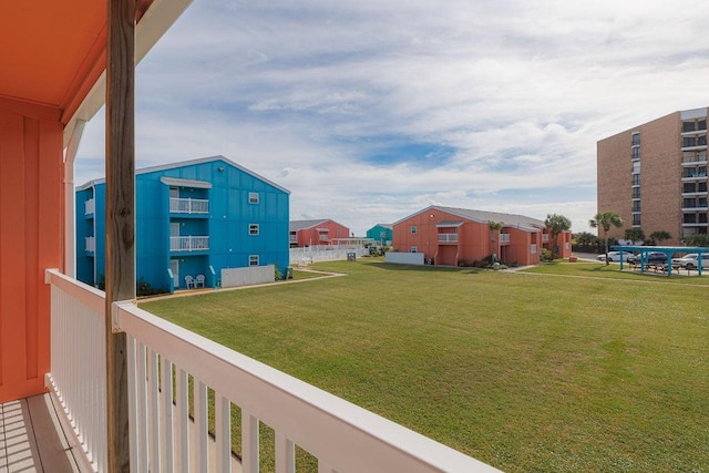 view of yard featuring a balcony