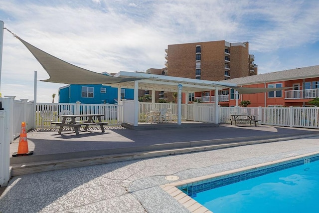 view of pool with a wooden deck