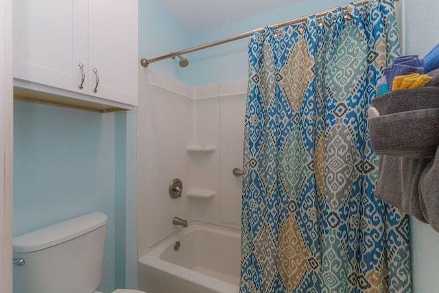 bathroom with shower / tub combo with curtain and toilet