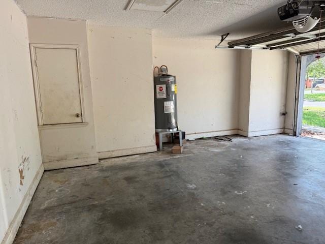 6026 Blue Water Dr, Corpus Christi, TX 78415 - garage with electric water heater, a garage door opener, and baseboards