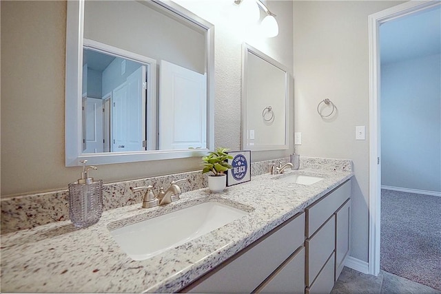 2538 Las Estrellas St, Corpus Christi, TX 78414 - bathroom with double vanity and baseboards
