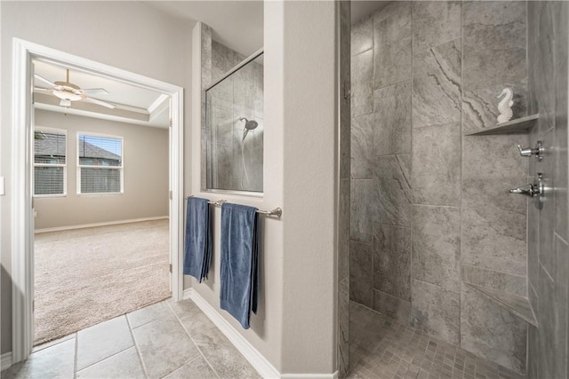 2538 Las Estrellas St, Corpus Christi, TX 78414 - bathroom featuring a tile shower, a ceiling fan, baseboards, and tile patterned floors
