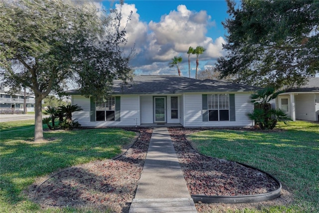 ranch-style home with a front yard