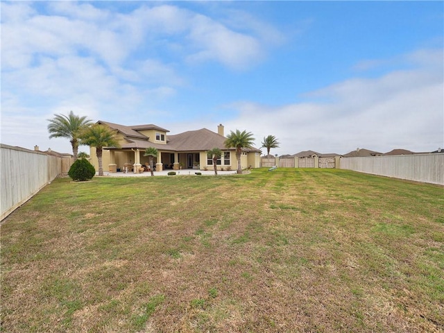 view of yard featuring a fenced backyard and a patio