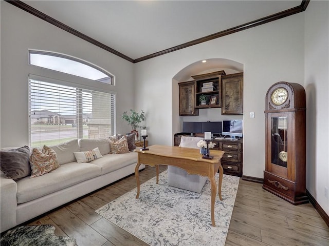 office featuring crown molding, baseboards, and wood finished floors