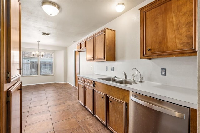 kitchen with a sink, visible vents, dishwasher, light countertops, and light tile patterned floors