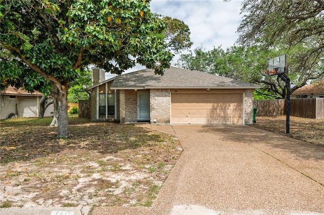 mid-century home with a chimney, driveway, an attached garage, fence, and brick siding