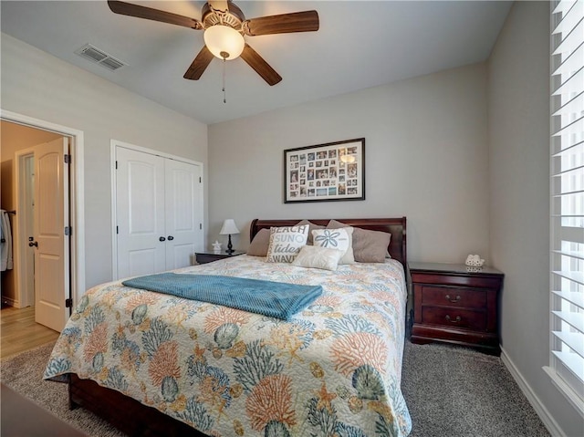 bedroom featuring carpet flooring, a closet, and ceiling fan