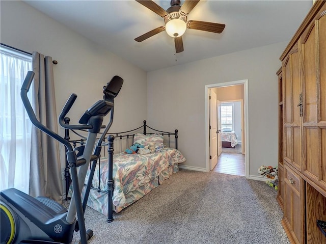 carpeted bedroom featuring ceiling fan