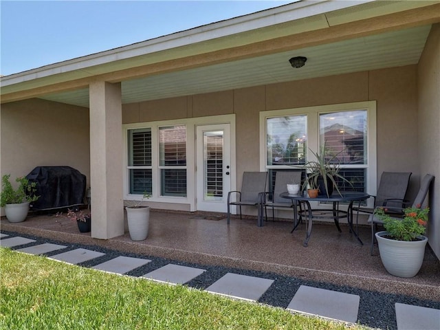 view of patio featuring a grill