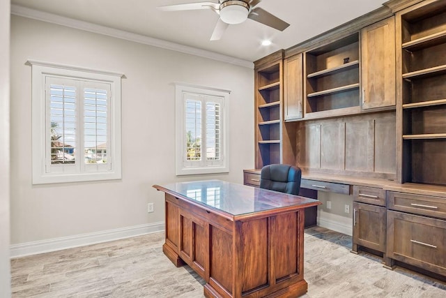 home office with light hardwood / wood-style flooring, ceiling fan, and crown molding