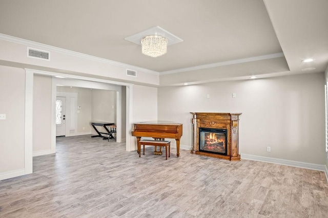 interior space featuring an inviting chandelier, wood-type flooring, and ornamental molding