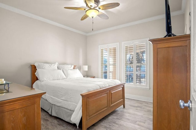 bedroom featuring ceiling fan, crown molding, and light wood-type flooring