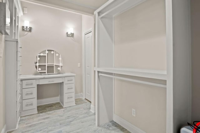 bathroom with vanity and wood-type flooring