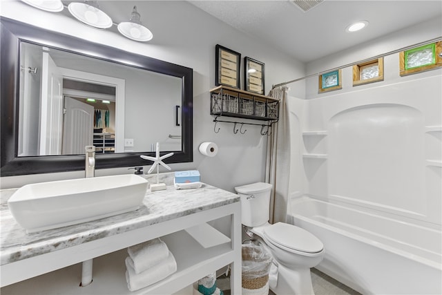 full bathroom with vanity, toilet, and shower / tub combo with curtain